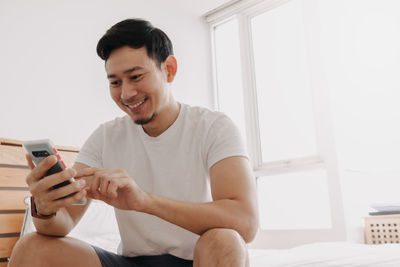 Young man using smart phone