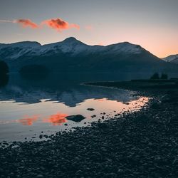 View of lake against sky during sunset