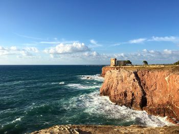 Scenic view of sea against cloudy sky