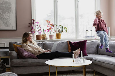 Mother with son on sofa