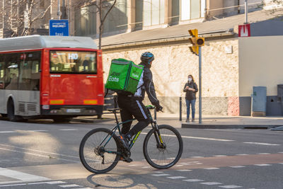 Man riding bicycle on street