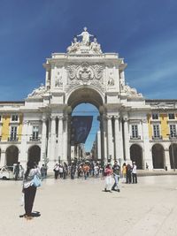 People in front of historical building