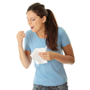 Young woman drinking coffee cup against white background