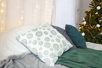 Close-up of man relaxing on bed at home