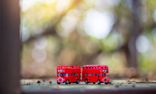 Close-up of red toy car on table