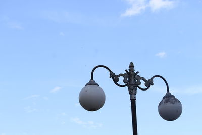 Low angle view of street light against sky