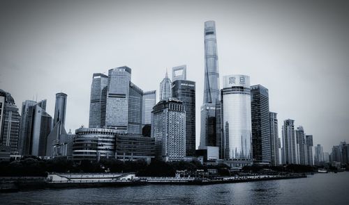 Skyscrapers in city against clear sky