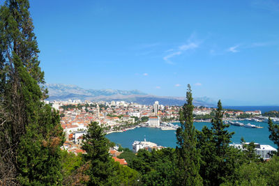 High angle view of townscape by sea