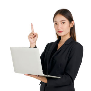 Young woman using smart phone against white background