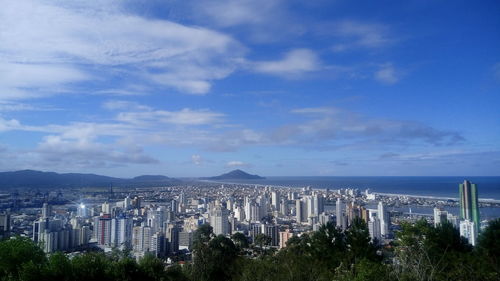 Aerial view of itajai up against cloudy sky