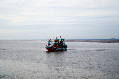 Boat in sea against sky