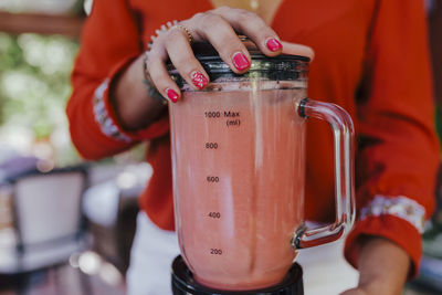 Close-up of woman holding drink