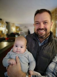 Portrait of cute baby and son