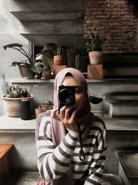 Portrait of man photographing