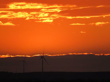 Scenic view of silhouette landscape against romantic sky at sunset