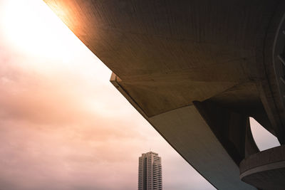 Low angle view of building against cloudy sky