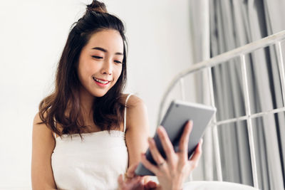 Young woman using mobile phone