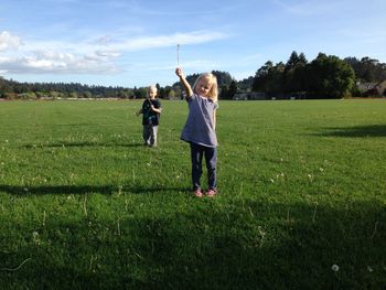 Children playing on grassy field