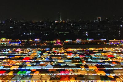 High angle view of illuminated city buildings at night