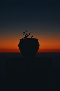 Close-up of silhouette plant against sky during sunset