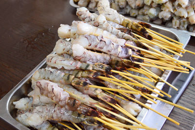 High angle view of meat on barbecue grill