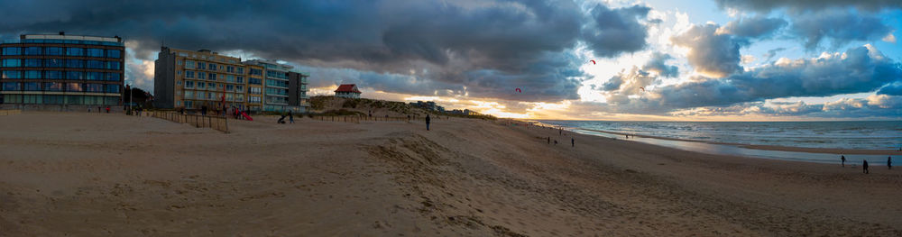 Panoramic view of beach against sky during sunset