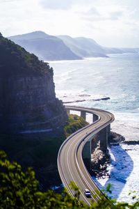 High angle view of road by sea against sky