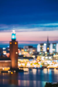 Defocused image of illuminated city at night