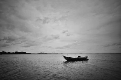 Boat in sea against sky