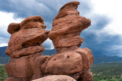 Low angle view of rock formation against sky