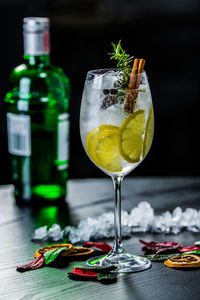 Close-up of drink on table against black background