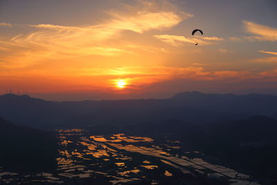 Paddy fields, sunsets and paragliders