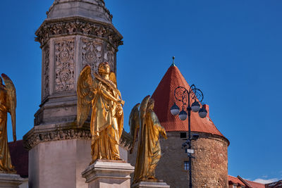 Low angle view of temple against clear blue sky