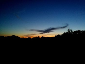 Silhouette trees against sky during sunset