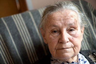 Close-up of senior woman at home