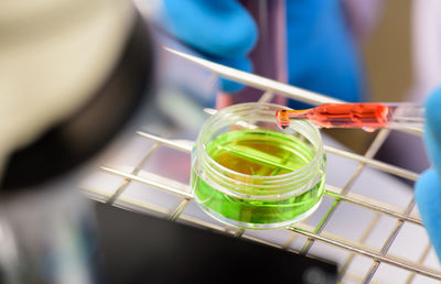 Close-up of medical professional holding chemical