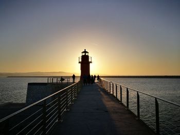 Scenic view of sea against clear sky during sunset