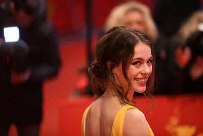 Close-up portrait of smiling young woman