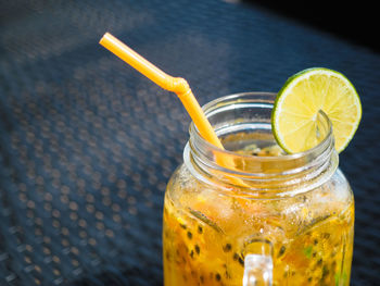 Close-up of drink in glass jar on table