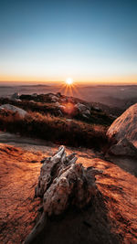 Scenic view of landscape against sky during sunset