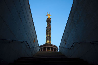 Low angle view of victory column against clear blue sky