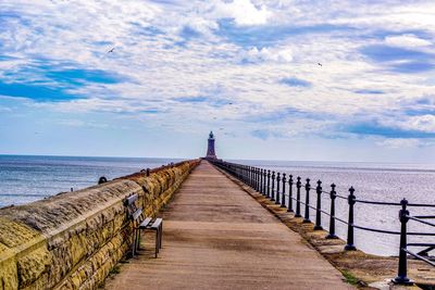 Pier over sea against sky