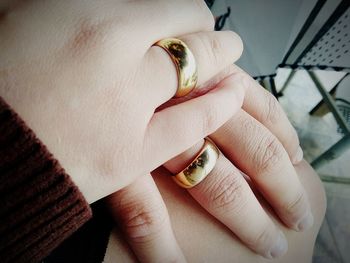 Cropped hands of woman wearing rings