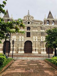 Facade of historic building against sky