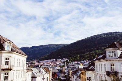 Town against cloudy sky