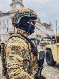 Rear view of army paratrooper soldiers standing in city