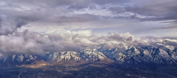 Wasatch front rocky mountain range aerial snow capped peaks winter urban salt lake city utah usa