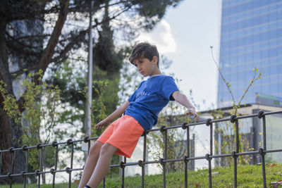 Child in a park practicing balance in madrid downtown centre.