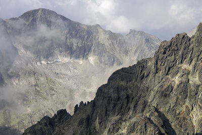 Panoramic view of mountains against sky during foggy weather