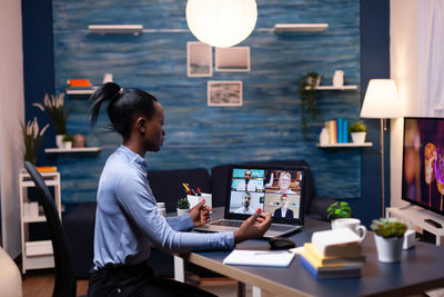 Businesswoman talking on video conference at office